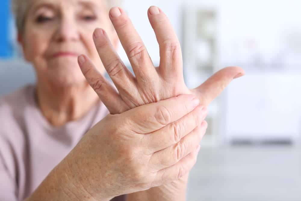 Close-up-of-senior-woman-touching-one-hand-with-the-other-hand