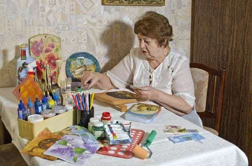 senior woman making crafts