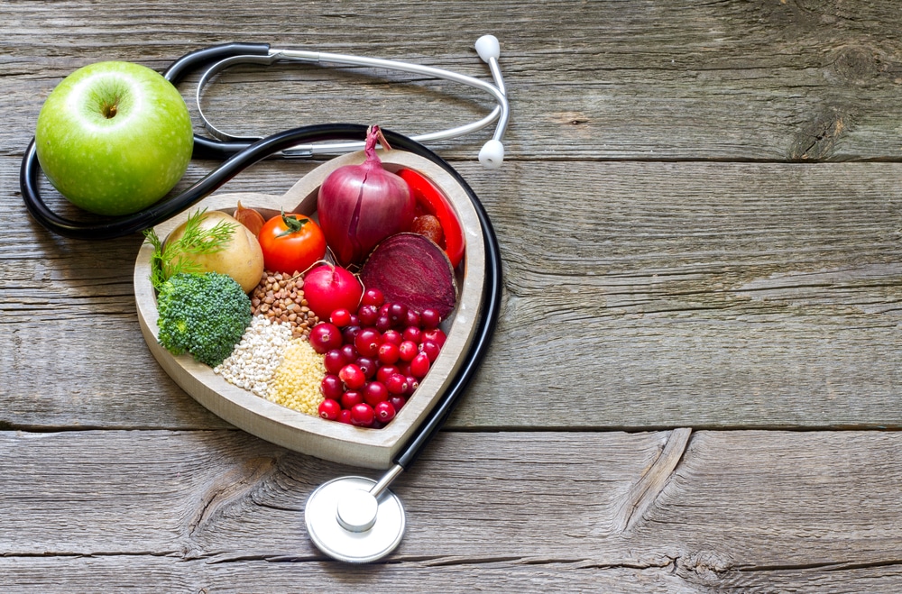 Stethoscope-and-healthy-food-in-a-heart-shaped-container