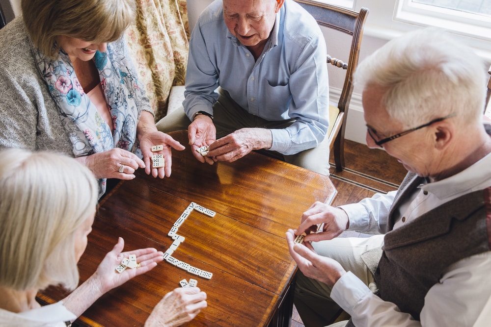 Senior friends playing dominos